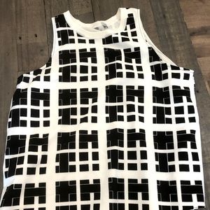 Medium sleeveless blouse. Lightly worn